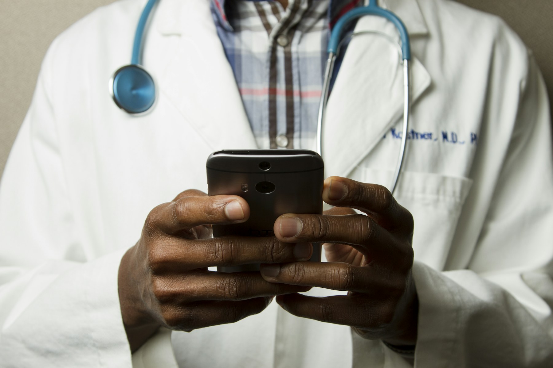 A clinician speaking with a patient during a digital consultation